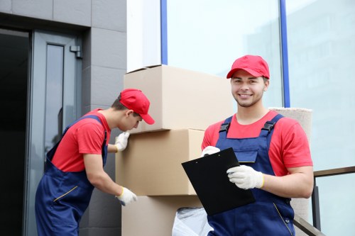 London removals team handling a busy city move with boxes and furniture