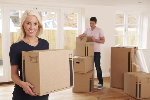 Team of movers carefully handling household belongings during a relocation