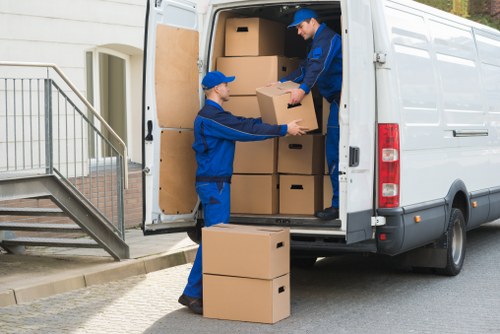 Man with van loading boxes in a London street