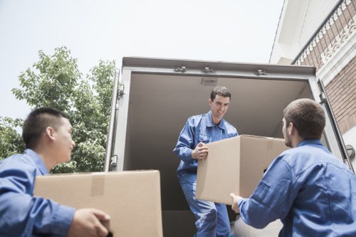 London house moving crew unloading boxes at a new home