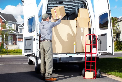 Man with van loading furniture for a London home move