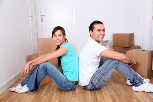 Local furniture removal service loading office chairs and desks in London