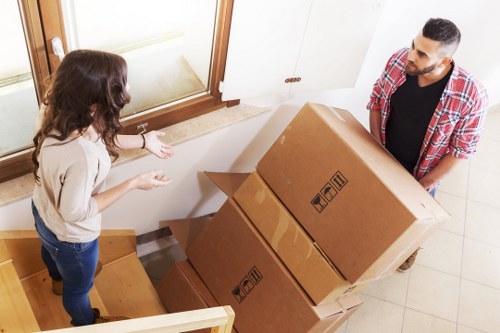 Packed office equipment and furniture ready for a business move