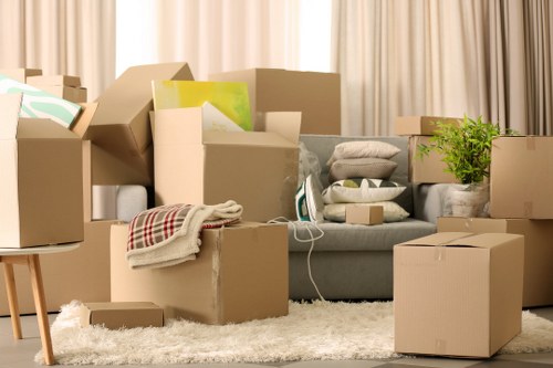 Team members using correct manual handling techniques during a move