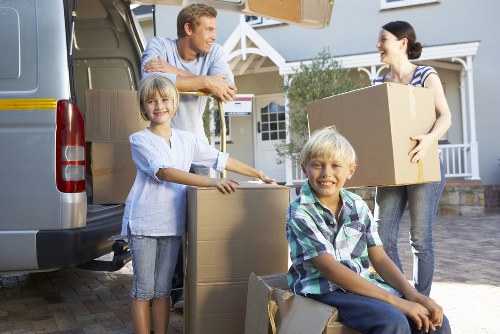 Man with a van handling boxes for a flat move in London