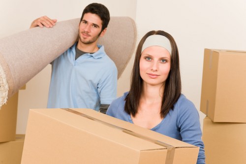 Business relocation team managing furniture placement in a London workspace