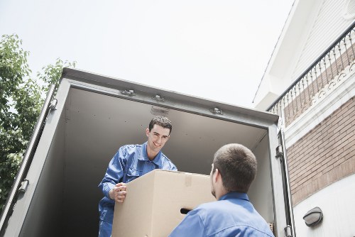 Carefully labelled boxes and office furniture in a commercial move