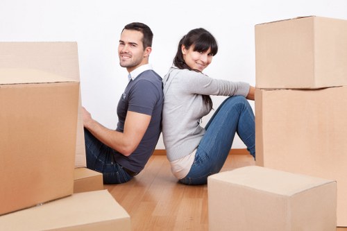 Packed moving boxes and protective materials ready for a London home relocation